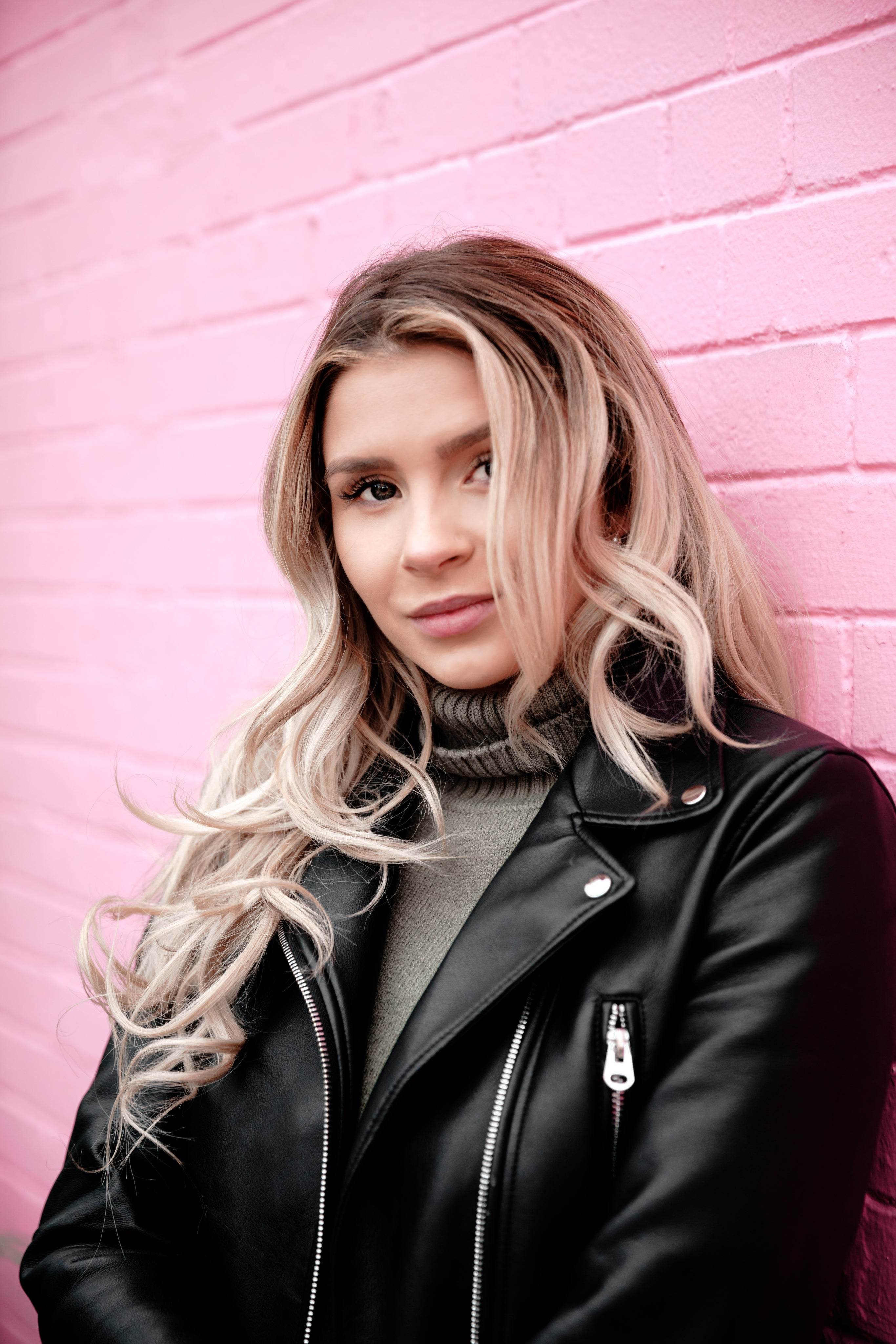 woman-portrait-on-pink-brick - Odelis London